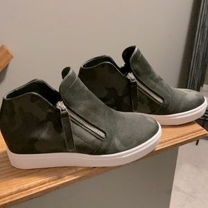 Women’s Steve Madden Black Camo wedge sneaker.